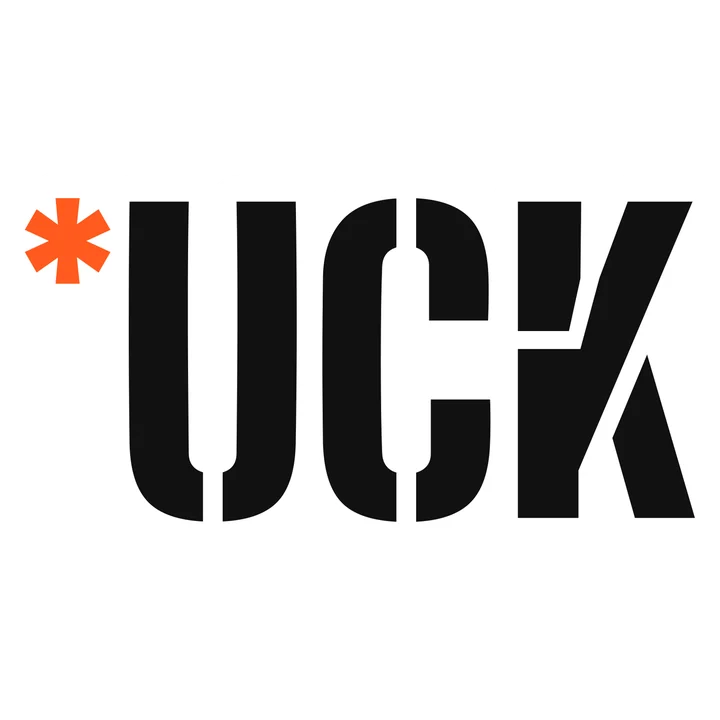 Die-cut sticker reading *UCK in black stencil letters with an orange asterisk