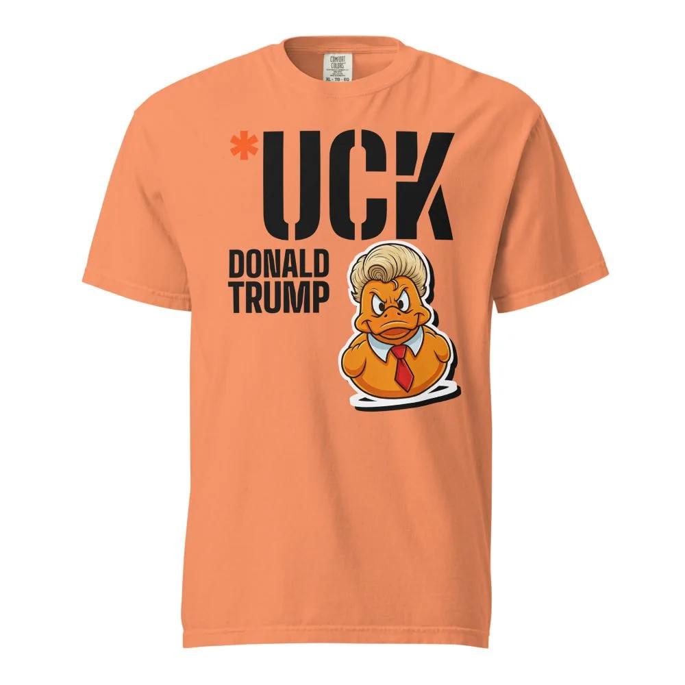 Terracotta heavyweight tee with a large stencil *UCK, DONALD TRUMP under it, and the duck sticker breaking out of the K
